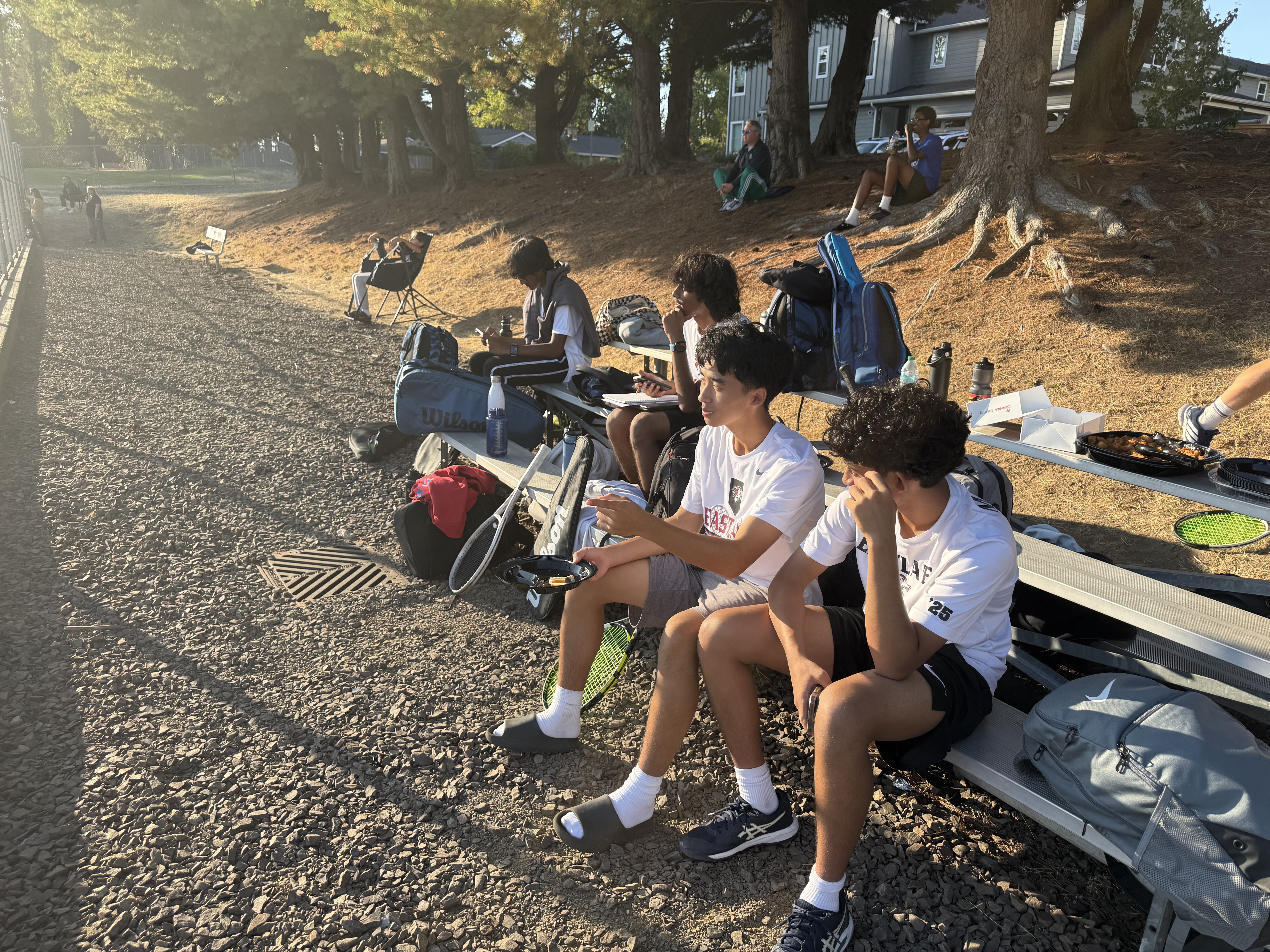 Eastlake Boys Tennis players gathered beside the courts